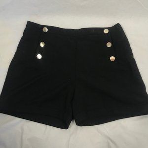 Black Shorts with gold buttons.
